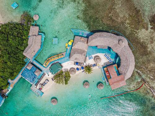 Roatan Sloth Farm and Little French Key Island Beach Excursion with Round-Trip Transport